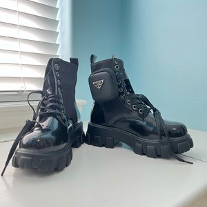 Combat boots with pouch.